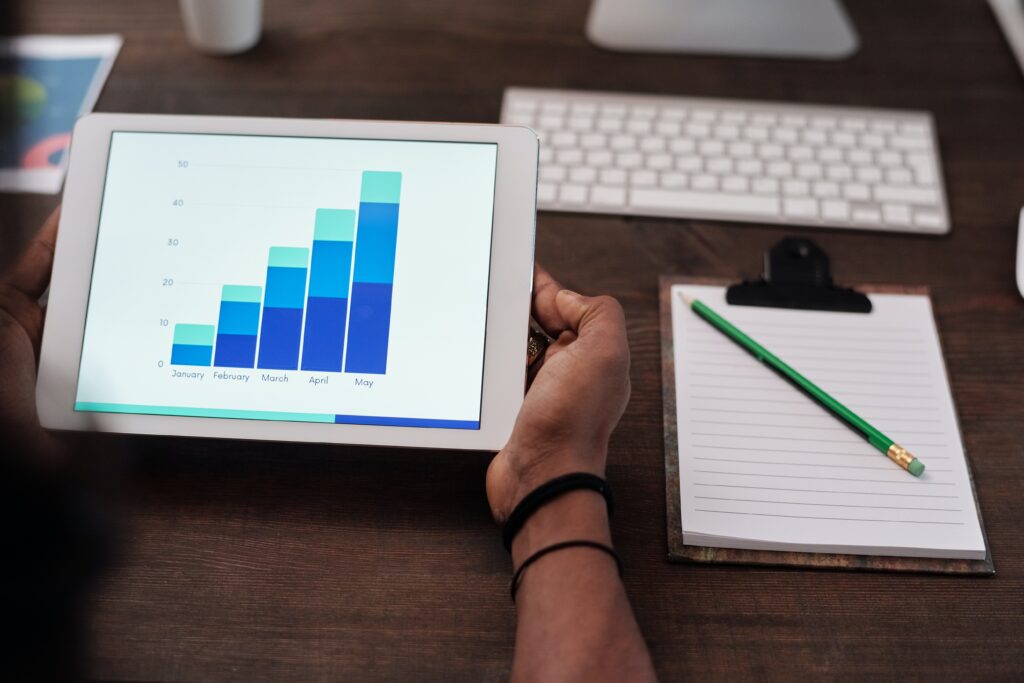 An iPad showing a chart on an upward trend month-on-month.